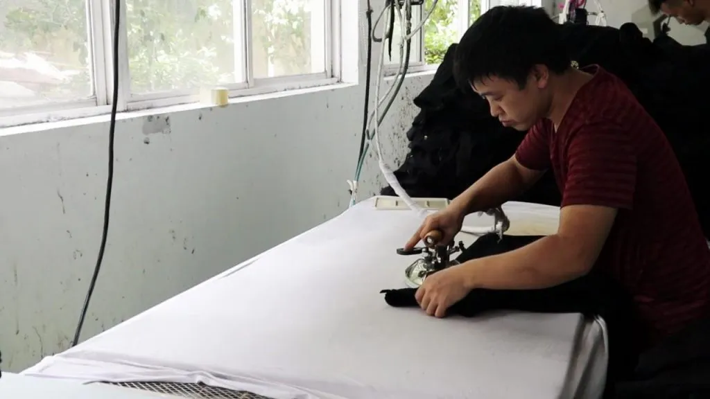 Garment pressing at Yuanchun